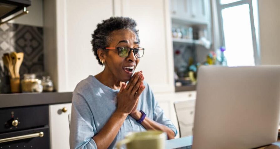 Close up of a senior woman using a laptop